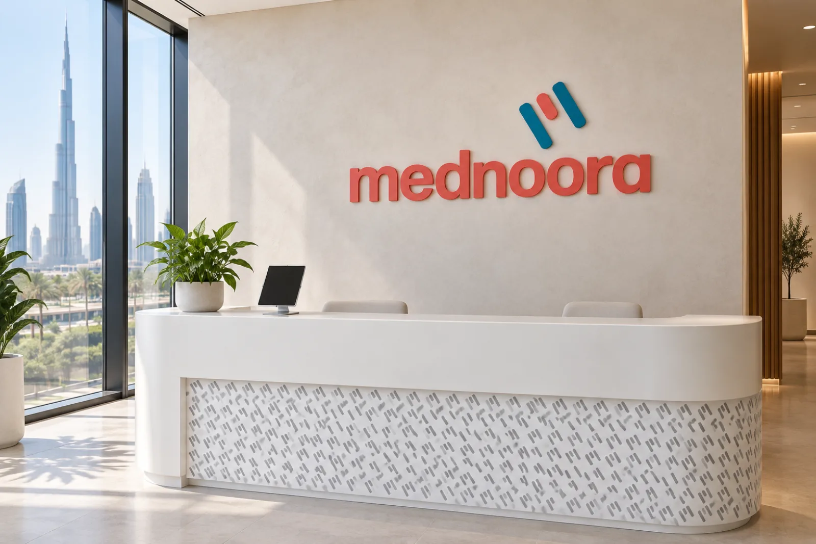 The Mednoora logo on a clinic reception wall above a white counter with the logo pattern