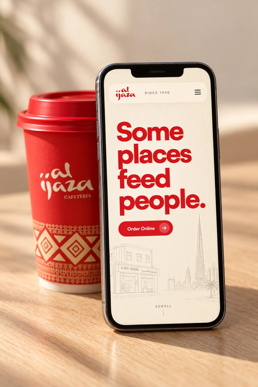 The Al Ijaza mobile site on a phone leaning on a red Al Ijaza cup