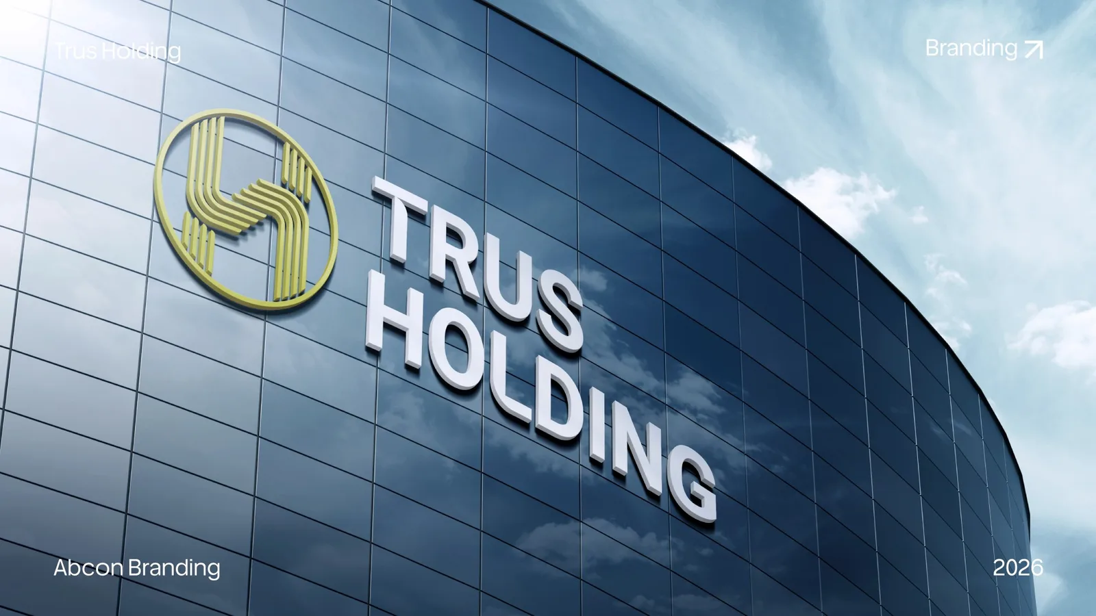 Trus Holding emblem and lettering on the curved glass front of an office building