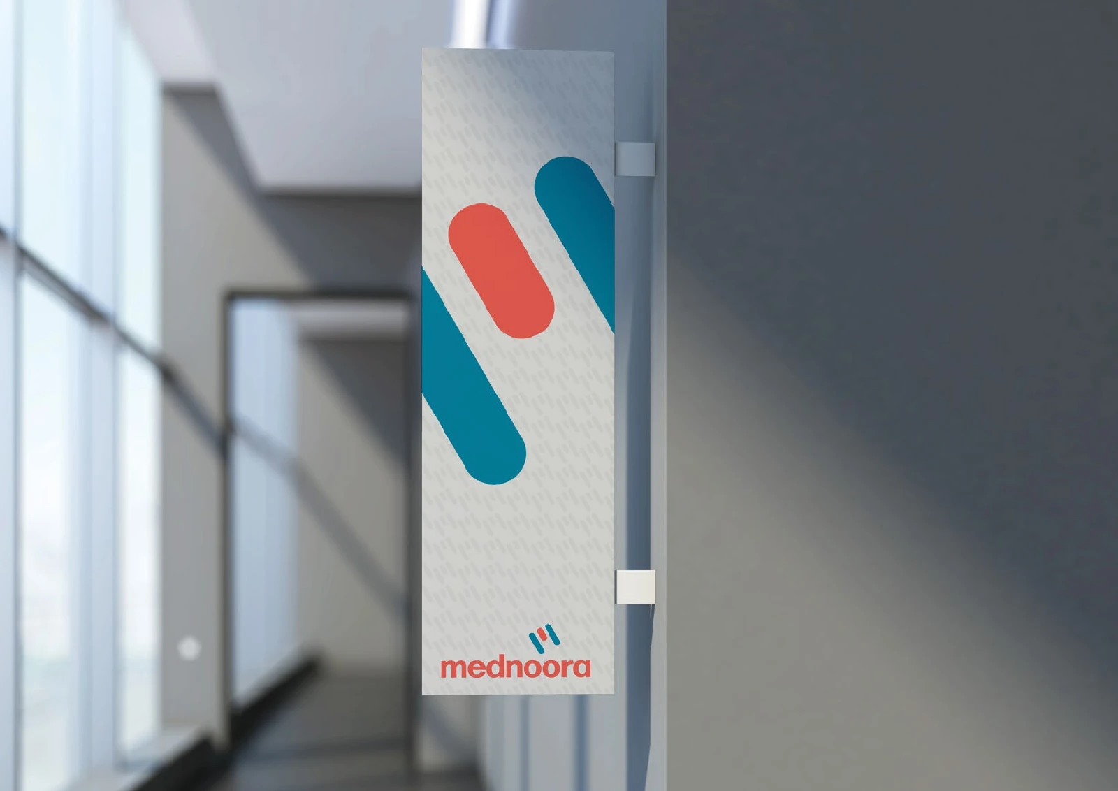Mednoora: a vertical hanging banner with an enlarged symbol in a corridor.