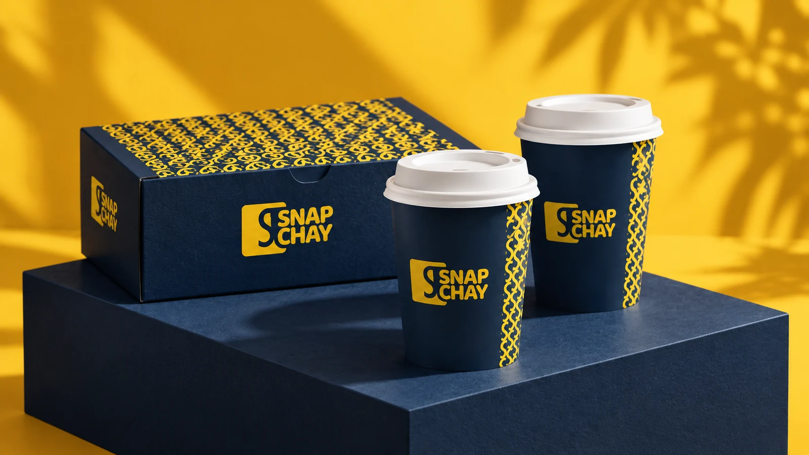 Snap Chay: navy-and-yellow takeaway box and branded tea cups, presentation cover