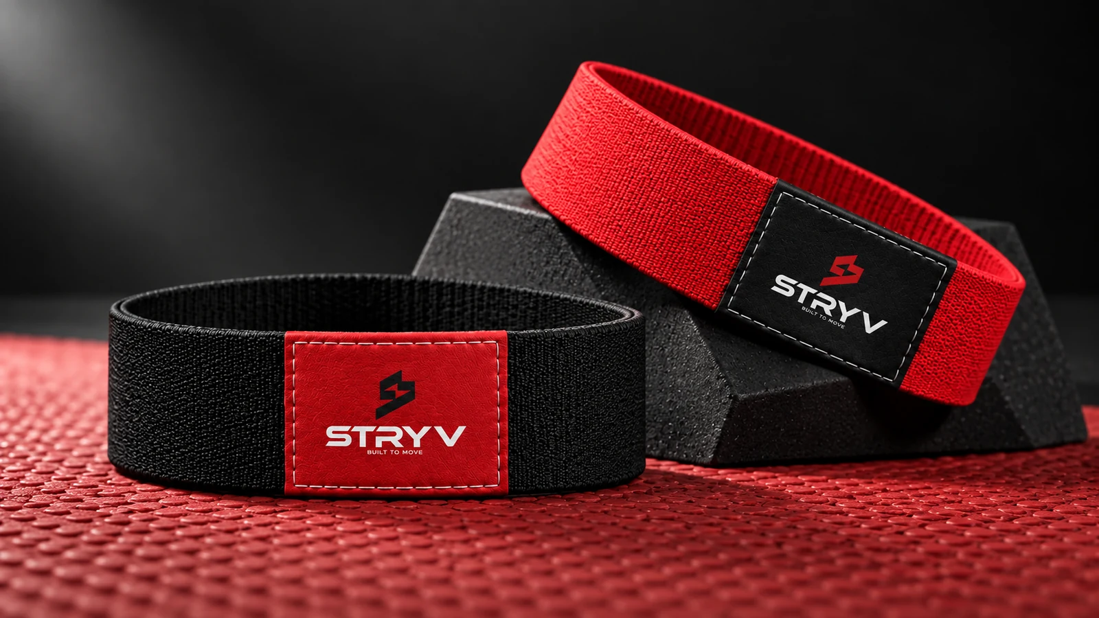Stryv: black and red fitness bands with square Stryv labels, presentation cover