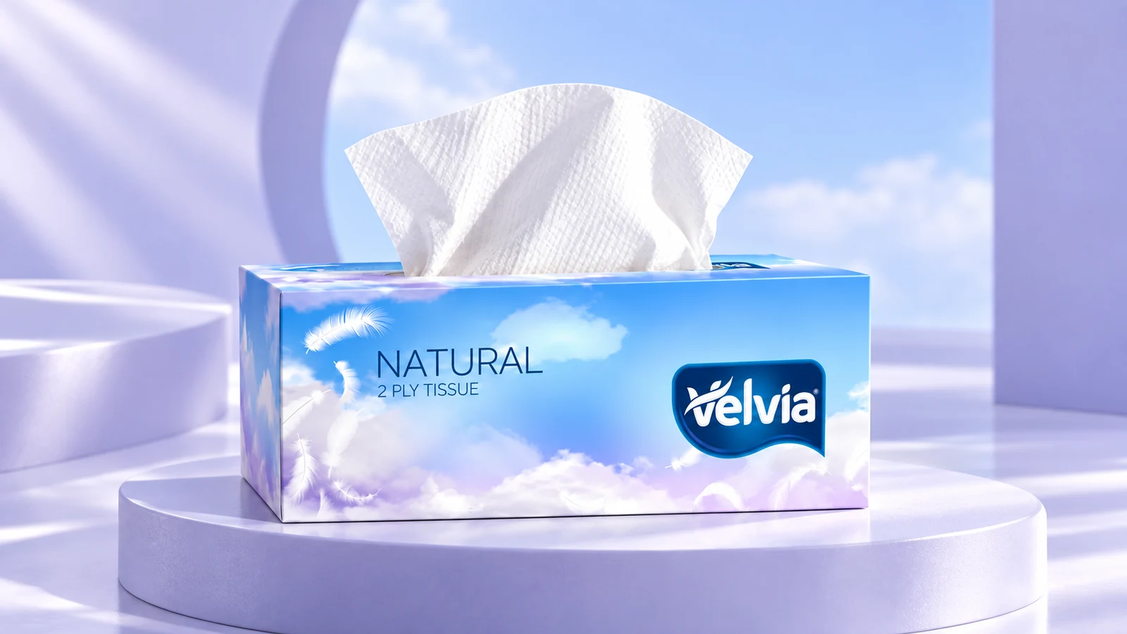 Velvia: blue-and-lavender tissue box with cloud graphics and the Velvia wordmark, presentation cover