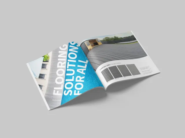 An open flooring catalogue showing grey decking, a blue heading and rectangular finish samples.
