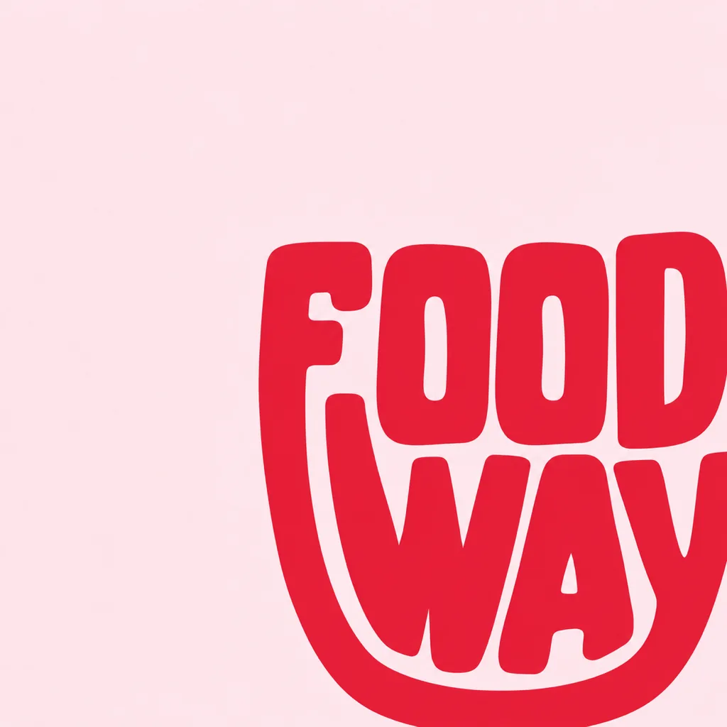 The Food Way cup-shaped lettering in red, enlarged and cropped off the corner of a pale pink field.
