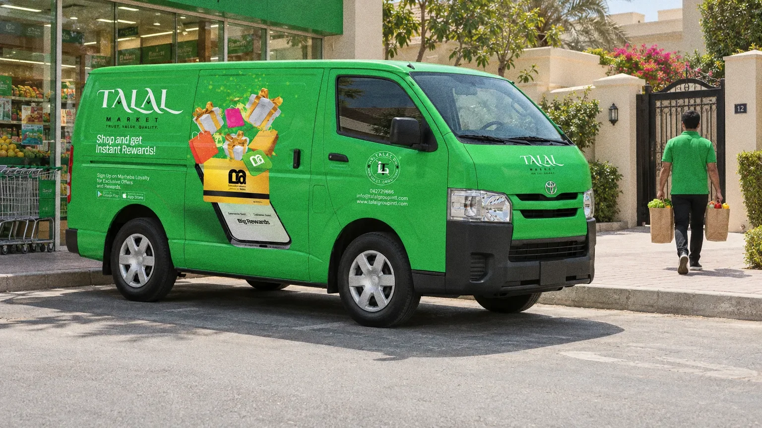 A green Talal Market van with its rewards graphic parked outside a neighbourhood supermarket while the driver carries grocery bags to a villa gate.