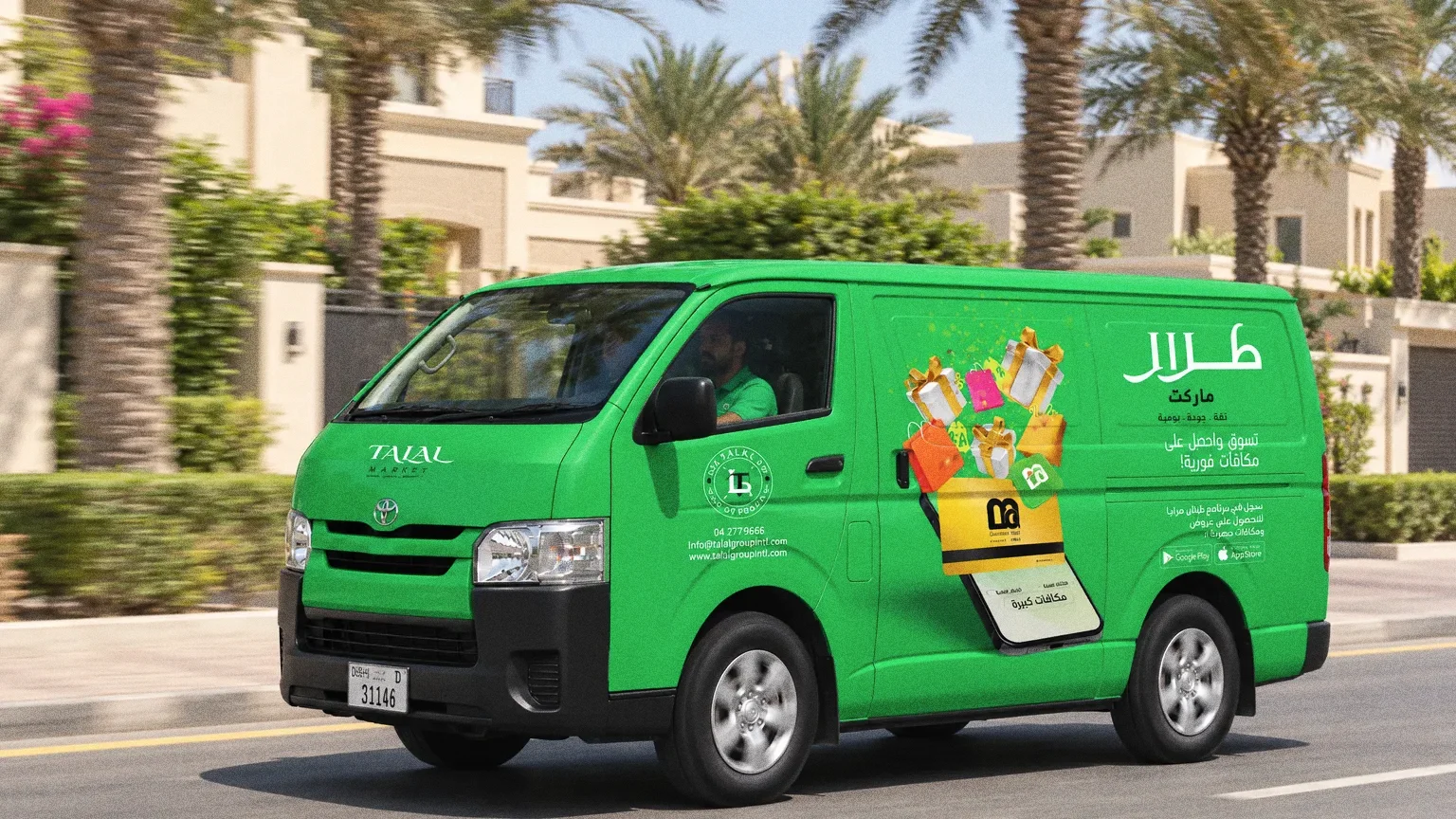 The Arabic side of the green Talal Market van driving along a palm-lined residential street in Dubai.