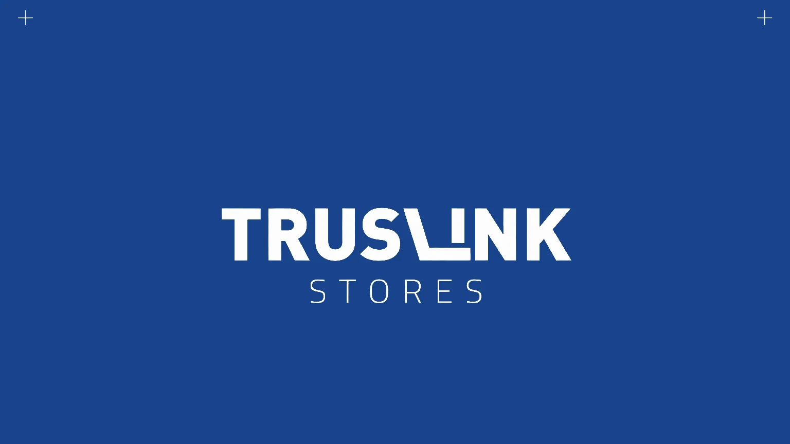 A flat Truslink blue brand book cover with the white Truslink Stores logo centred and small registration crosses in the corners.