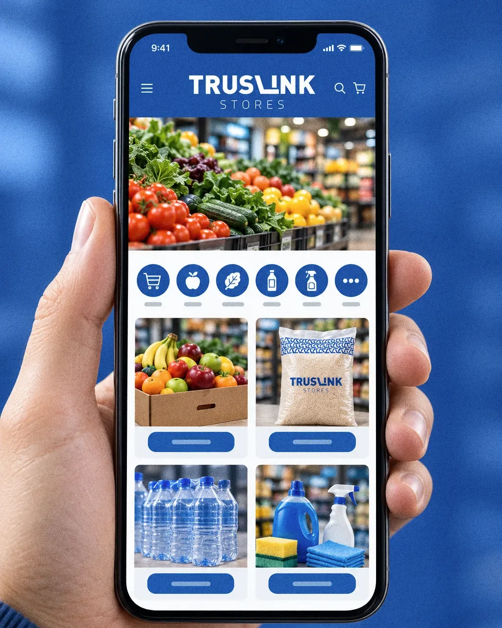 A hand holding a phone that shows a Truslink Stores mobile shop with a blue header, produce banner, category icons and product photos.